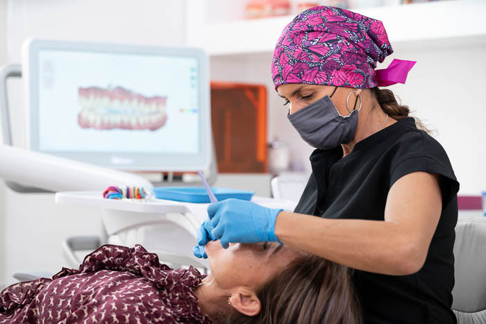 The patient is undergoing a dental consultation for dental implants in Mexico.