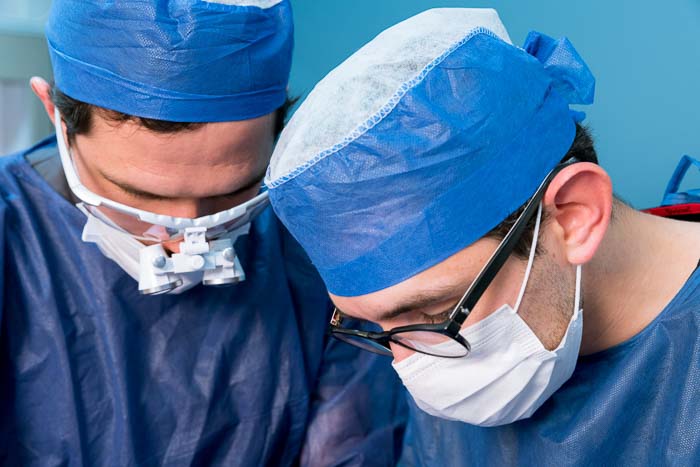 Full Mouth Implants doctors working on a patient in Mexico.