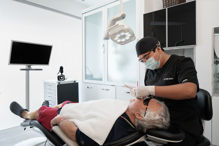 The patient is having a consultation for traditional denture procedure in Mexico.